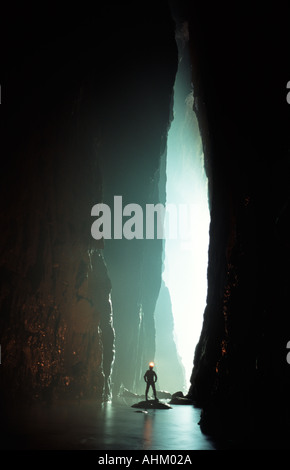 A caver in a massive river cave Sichuan province China Stock Photo