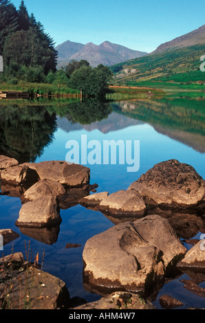 The peaks of Snowdonia perfectly mirrored in Llyn Mymbyr, North Wales Stock Photo