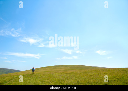 Lone walker on Fan Lila mountain top open moorland in the Brecon Beacons National Park Powys South Wales UK Stock Photo