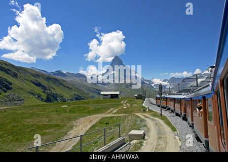 GGB Gornergratbahn Railway train progresses towards Gornergrat with Matterhorn in the background Stock Photo