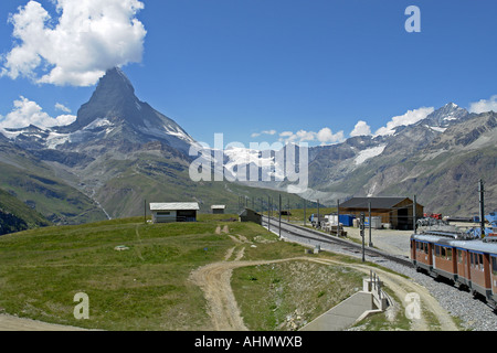 GGB Gornergratbahn Railway train progresses towards Gornergrat with Matterhorn in the background Stock Photo