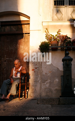 Sicilian sitting in the sun Stock Photo