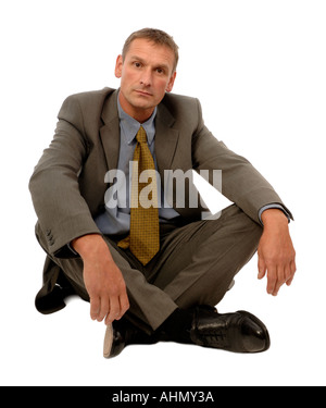 relaxed man sitting on the floor on white background Stock Photo - Alamy