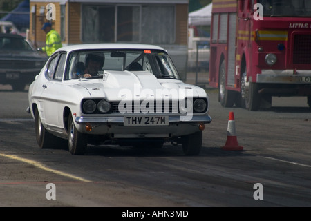 Heavily modified Ford Capri leaving startline at drag race Stock Photo