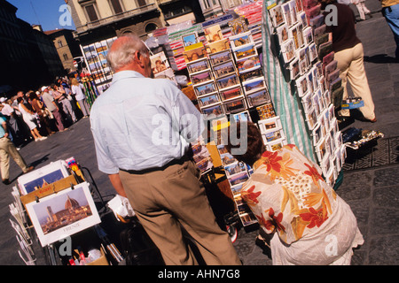 Europe Italy Florence Tuscany Tourists at a Tourism Kiosk Buying Postcards Stock Photo