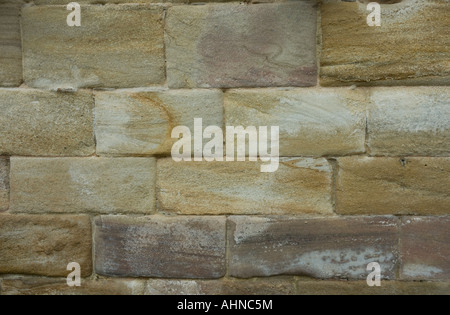 Old light coloured sandstone stone wall Stock Photo