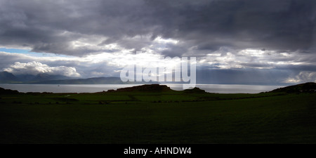 Shaft of sunlight over Arran from Bute, West Coast of Scotland, UK Stock Photo