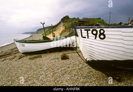 UK Suffolk Dunwich beach, fishing boats beached on the shingle Stock Photo