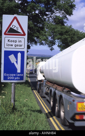 lorry passing emergency escape lane warning sign in case of brake failure on steep hill at staxton scarborough yorkshire uk Stock Photo