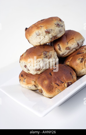 Raisin buns piled up on a plate Stock Photo