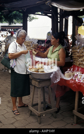 Woman buying bread in the Mercado Municipal market, Masaya, Nicaragua, Central America Stock Photo