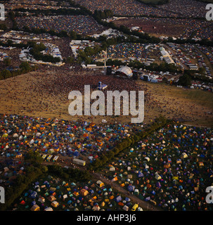 Glastonbury Festival Somerset UK aerial view of crowds and stages at dusk Stock Photo