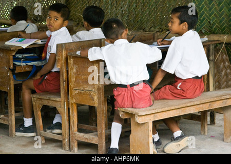 Boys Study at Desks in their Classroom Bali Indonesia Stock Photo