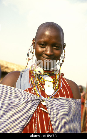 Vertical format close up portrait of a young Maasai woman near the Masai Mara National Reserve Kenya East Africa Stock Photo