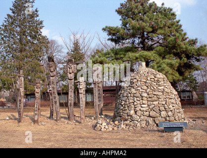 Wooden poles Stone sculpture on the Kyongbokkung Palace grounds Seoul South Korea in winter Stock Photo