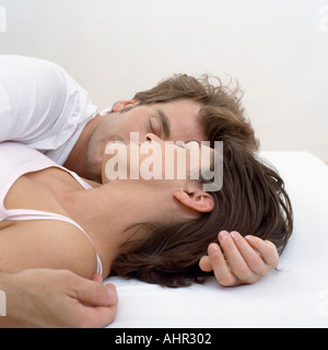 Couple asleep in bed Stock Photo