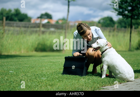 Dog and owner on way to work Stock Photo