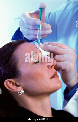 Woman having neurotoxin injection Stock Photo