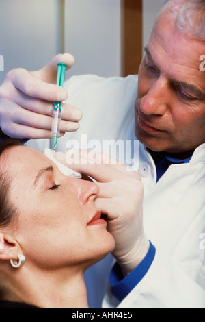 Woman having neurotoxin injection Stock Photo