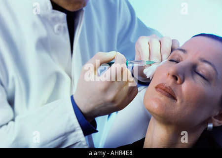 Woman having neurotoxin injection Stock Photo