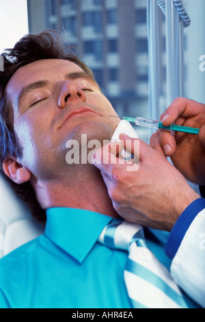 Man having neurotoxin injection Stock Photo