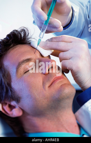 Man having neurotoxin injection Stock Photo