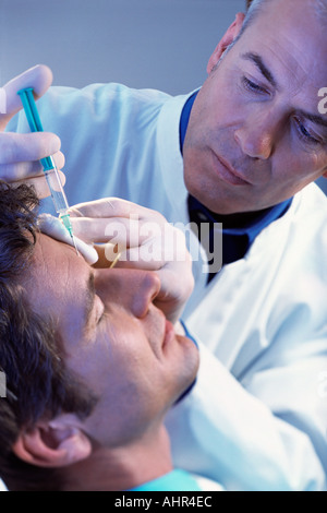 Man having neurotoxin injection Stock Photo