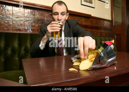 Businessman in a pub Stock Photo