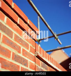 Scaffolding on brick wall Stock Photo