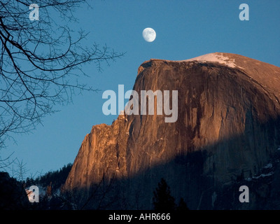 Sunset and moonrise over Half Dome Yosemite National Park California USA Stock Photo