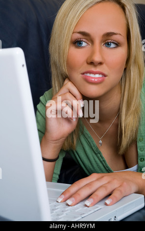 A beautiful young woman using her laptop Stock Photo