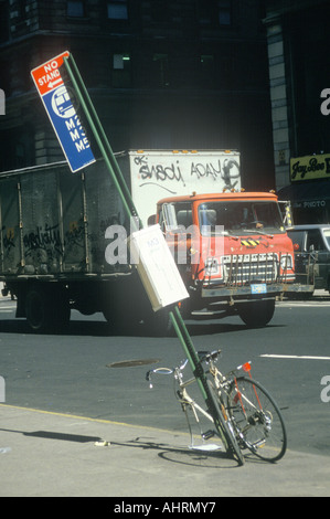 Vandalized bicycle and graffiti covered truck South Bronx New York Stock Photo