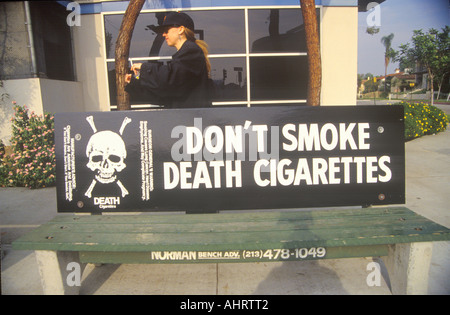 Anti cigarette slogan on bus stop Stock Photo
