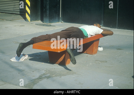 sleeping homeless man 2 New York City subway Stock Photo - Alamy