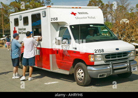 Victims of Hurricane Ivan in Pensacola Florida suburb come to Red Cross emergency for food water and ice Stock Photo