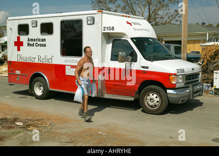 Victims of Hurricane Ivan in Pensacola Florida suburb come to Red Cross emergency for food water and ice Stock Photo