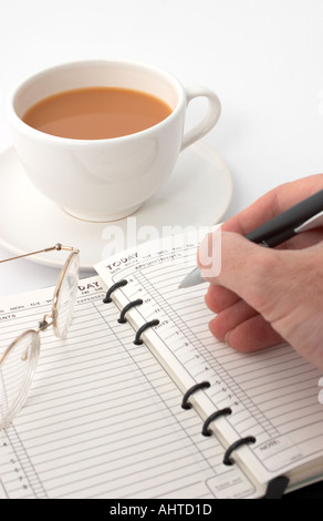 making an appointment in a diary Stock Photo