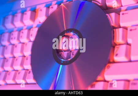 cd or dvd on a computer keyboard Stock Photo