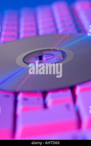 cd or dvd on a computer keyboard Stock Photo