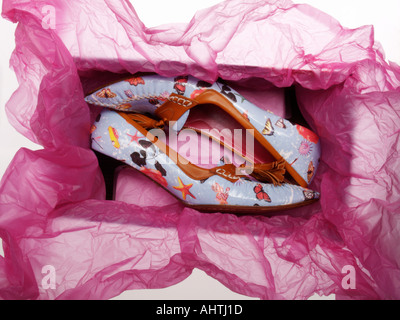 Fancy fashionable trendy womens shoes in shoebox with pink violet purple wrapping paper gift cadeau buying shopping Stock Photo