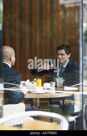 Two businessmen in a restaurant Stock Photo