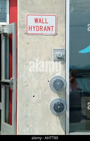 Wall mounted fire hydrant for emergency use located in downtown Chicago Illinois Stock Photo