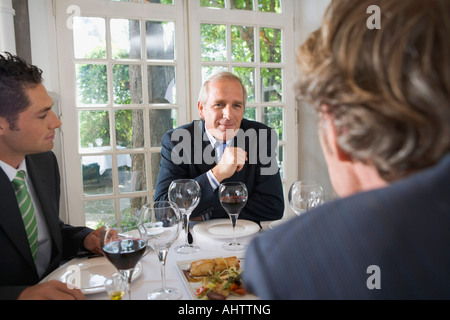 Three businessmen having lunch Stock Photo