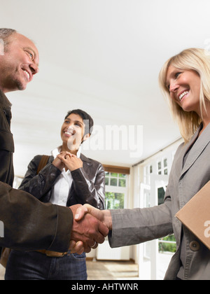 The male real estate agent and male client in the apartment Stock Photo ...