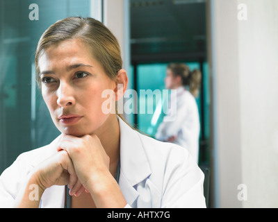 Portrait of female doctor with female doctor in background. Stock Photo