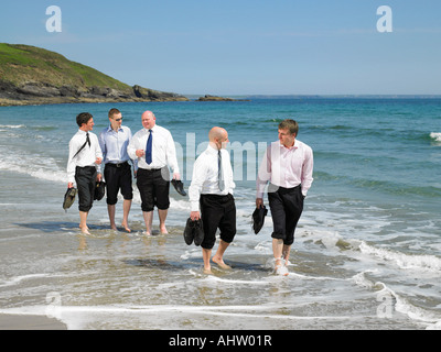 Group of businesspeople on the beach. Stock Photo