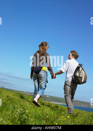 Young couple outdoors holding hands. Stock Photo