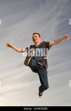 Man leaping through the air Stock Photo