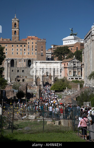 tourists stream through the centre of the Imperial roman Forum Rome Lazio Italy Stock Photo