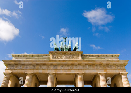 Horizontal wide angle of the Goddess of victory statue adourning the top of the Brandenburg Gate on Pariser Platz on a sunny day Stock Photo